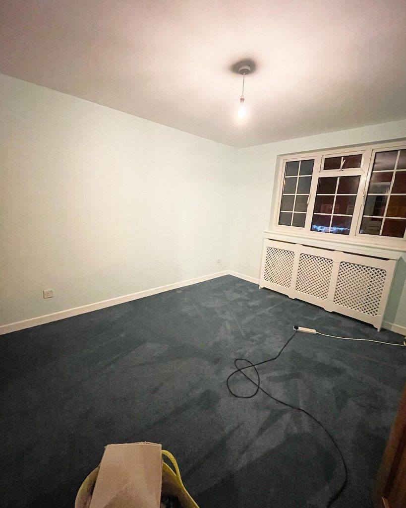 Bedroom with blue walls and fresh blue carpet. Walls were replastered and then painted. Project by The Big Conversion Company.